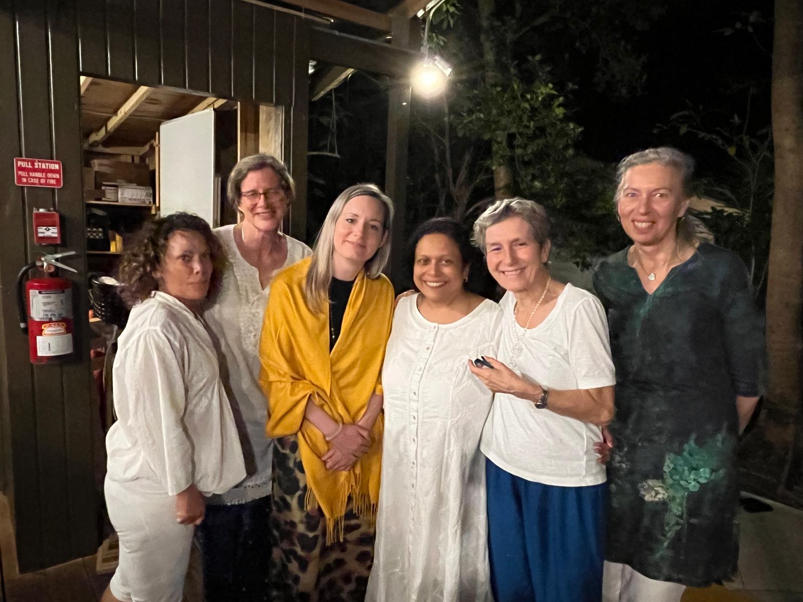 Six members of the Sangha sharing an evening gathering